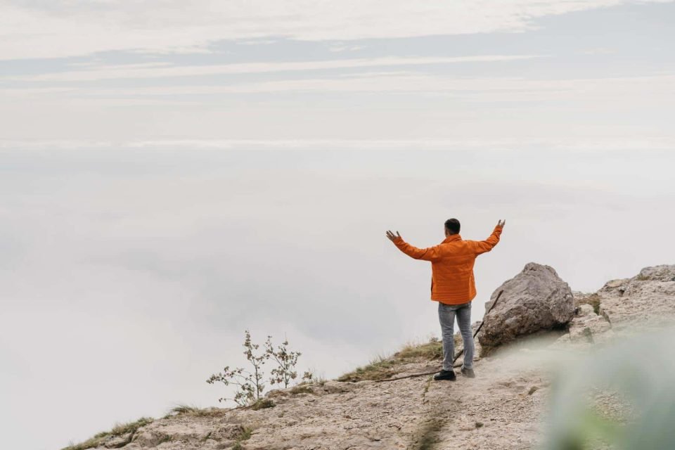 Man looking at the global mountains